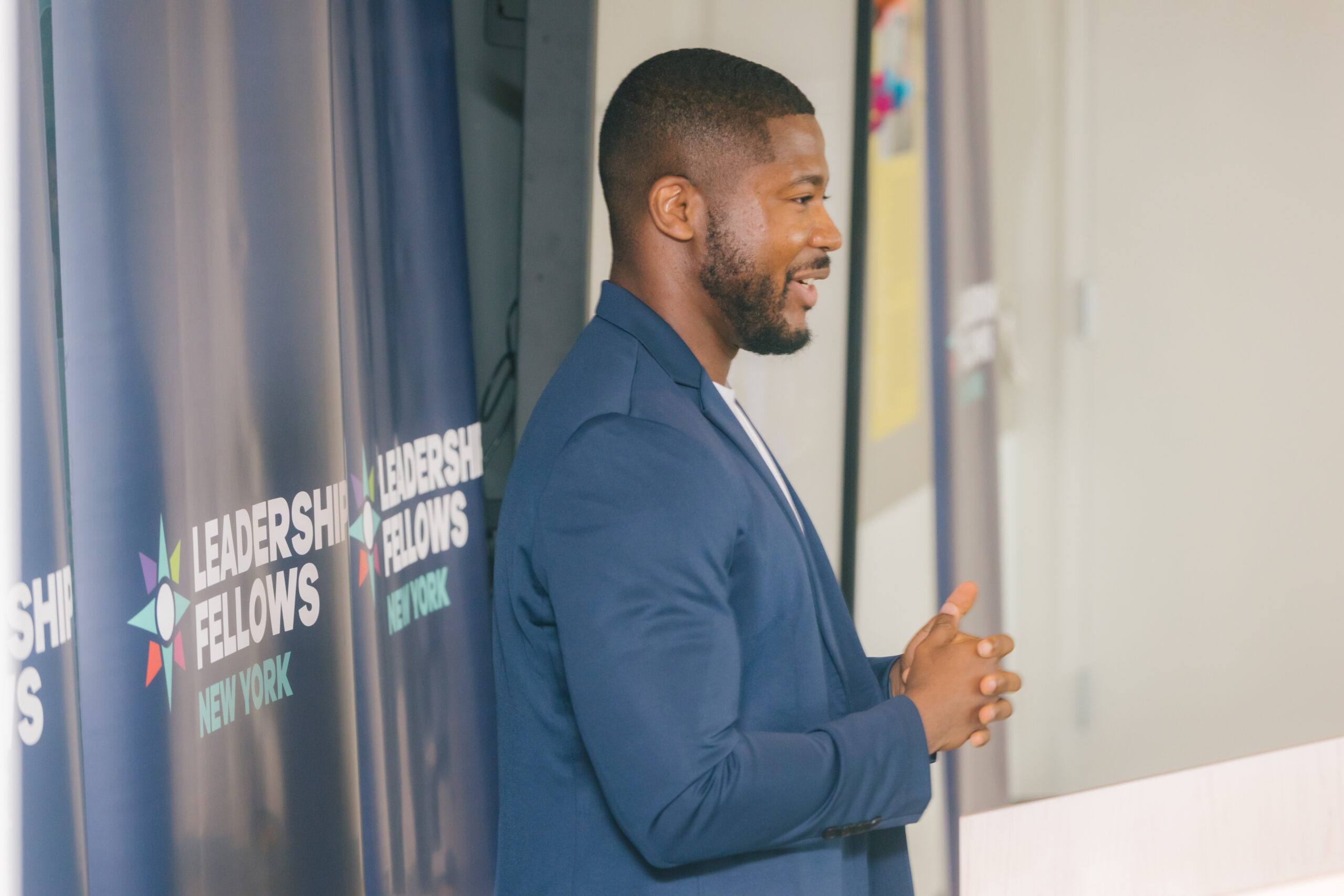 A fellow standing and giving a speech